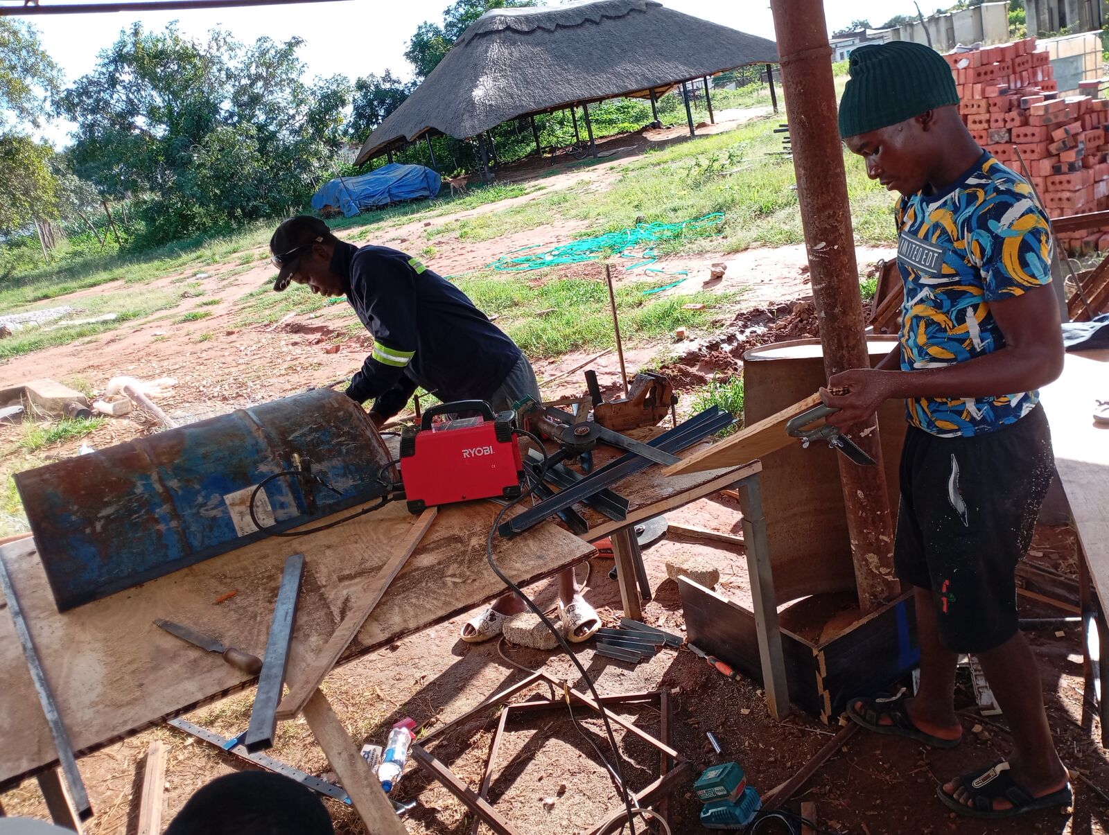 David and team member working on welding and metal assembly