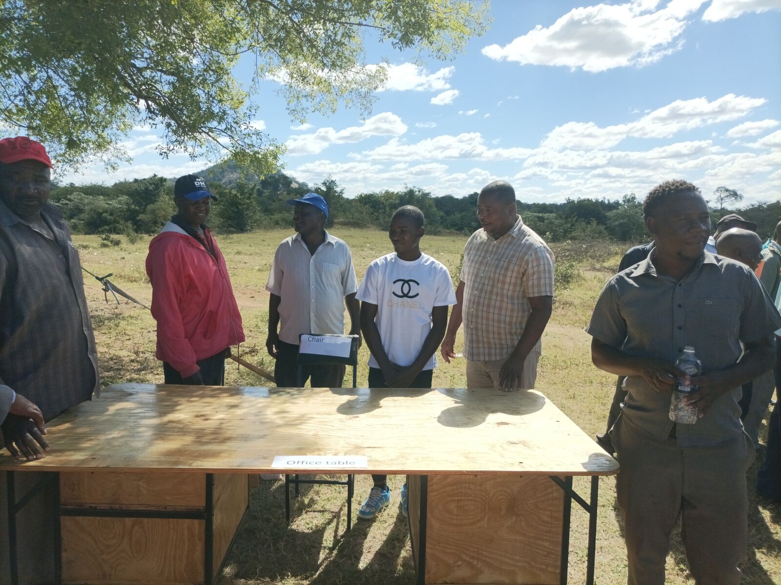 David presenting his metalwork to community officials