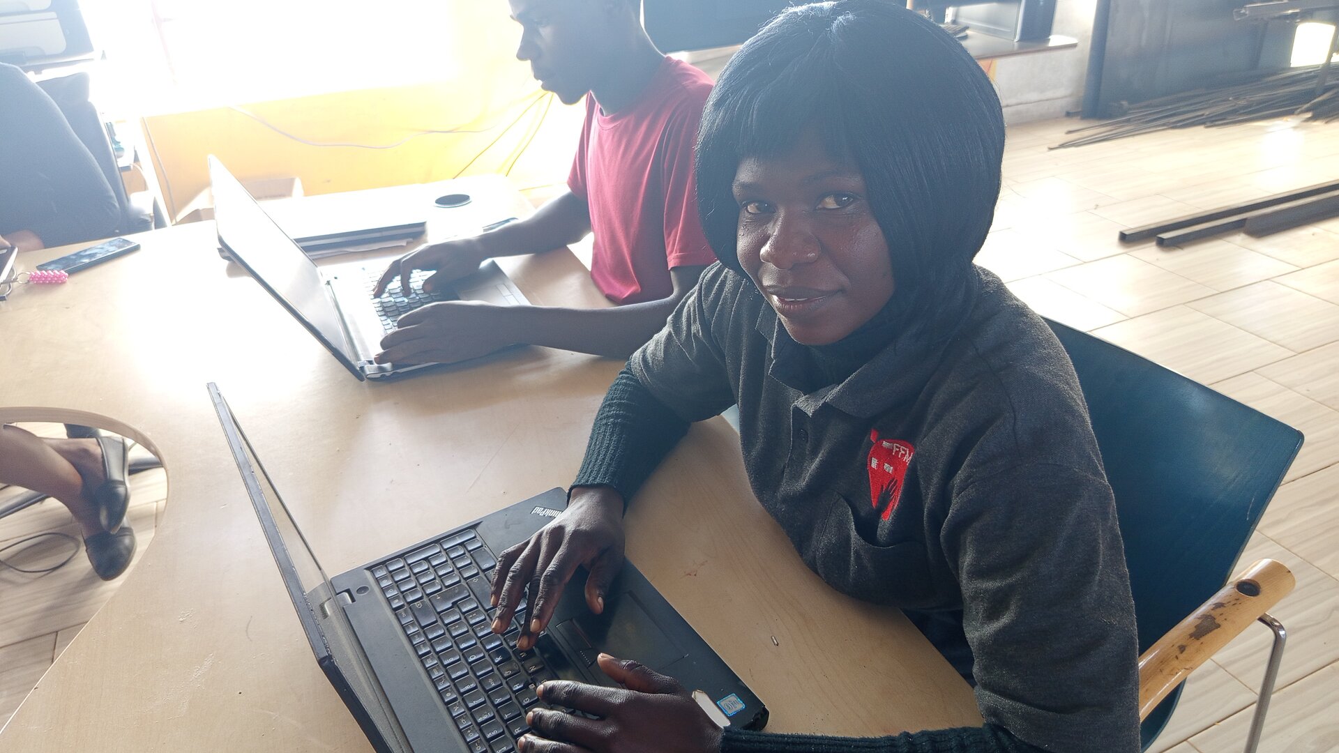 Students learning digital skills in the Nook computer lab